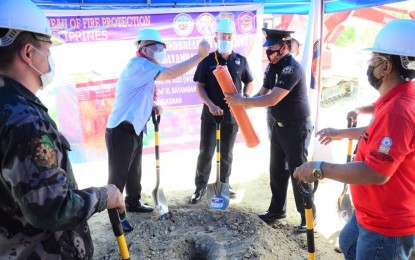 <p><strong>GROUNDBREAKING</strong>. Bayambang town Mayor Cezar Quiambao (second from left), Bureau of Fire Protection (BFP) provincial director Supt. Georgian Pascua (middle), and BFP-Bayambang officer-in-charge SFO3 Randy Fabro (second from right) placed the capsule during the groundbreaking ceremony for the new BFP building in Bayambang town Pangasinan on April 14, 2021. The new fire station is located at Barangay Zone VI.<em> (Photo courtesy of Balon Bayambang Facebook page)</em></p>