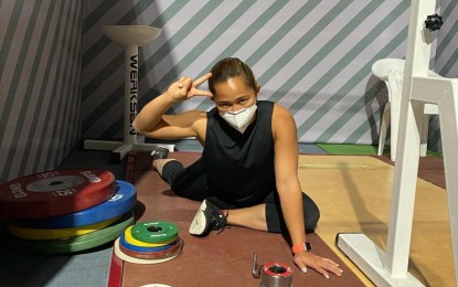 <p><strong>OLYMPIAN.</strong> Weightlifter Hidilyn Diaz takes a break during her training in Tashkent, Uzbekistan on Thursday (April 15, 2021). The 2016 Rio de Janeiro Games silver medalist only needs to compete in the ongoing Asian Weightlifting Championships to become the seventh Filipino qualifier to the Tokyo Games this year. <em>(Photo courtesy of Hidilyn Diaz Instagram)</em></p>