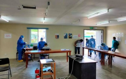 <p><strong>SWABBING.</strong> The rural health unit of Calinog in Iloilo conducts swab tests on workers of the Daewoo Engineering and Construction firm in Barangay Agcalaga on Thursday (April 15, 2021). The rise in Covid-19 cases in the town prompted adjacent Lambunao to impose border restrictions effective April 19. <em>(Photo courtesy of Bayan ng Calinog Facebook)</em></p>