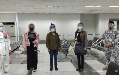 <p><strong>HOME.</strong> The latest batch of Filipino human trafficking victims from Syria arrives in Manila on Saturday (April 17, 2021). Representatives from the Department of Foreign Affairs welcomed the trio at the Ninoy Aquino International Airport. <em>(Photo courtesy of DFA)</em></p>