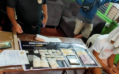<div dir="auto"><strong>DRUG HAUL</strong>. A 19-year-old male suspect (right, with covered face) was arrested in a buy-bust operation at Purok Sigay, Barangay 2, Bacolod City on Saturday (April 17, 2021) by a joint team of the Philippine National Police and National Bureau of Investigation. Operatives seized from the suspect 396 grams of suspected shabu worth PHP2.6 million<em>. (Photo courtesy of Bacolod City Police Office)</em></div>