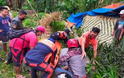 <p><strong>TYPHOON CASUALTY</strong>. Responders retrieve the body of a man hit by an uprooted coconut tree due to strong winds brought about by Typhoon Bising in San Isidro village, St. Bernard, Southern Leyte late Sunday (April 18, 2021). Two persons died, three were injured, and thousands were displaced when "Bising" crossed Eastern Visayas. <em>(Photo from Ormoc News and Update FB page)</em></p>