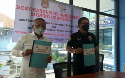 <p><strong>PARTNERSHIP</strong>. BFAR-7 regional director Dr. Allan Poquita (left) and ACCERT president Dr. Miguel Ortiz (right) are shown after signing a memorandum of agreement on Monday (April 19, 2021) for the strengthening of the region's anti-illegal fishing drive. The agreement stipulates that ACCERT members will serve as volunteer units or force multipliers and mutual partners on fishery law enforcement. <em>(Photo courtesy of BFAR-7)</em></p>