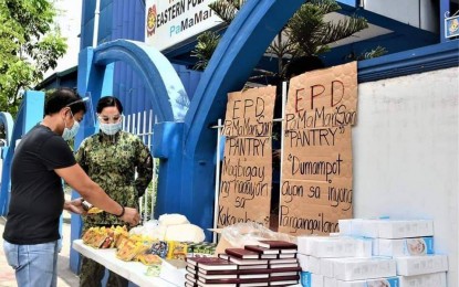 <p><strong>FOOD FOR THE SOUL.</strong> Copies of the Bible are among the items given for free at the Eastern Police District's Community Pantry in its headquarters in Pasig City on Tuesday (April 20, 2021). EPD director, Brig. Gen. Matthew Baccay, said the measure aims to provide spiritual nourishment to the beneficiaries of the community pantry. <em>(Photo courtesy of EPD)</em></p>