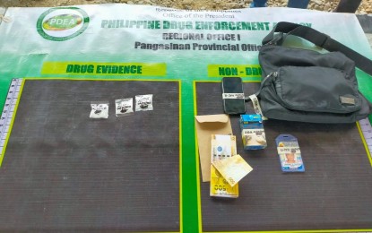 <p><strong>BUSTED. </strong>Personnel of the Philippine Drug Enforcement Agency (PDEA) Pangasinan Provincial Office as the lead unit, Urdaneta City Police Station, and 104th Maneuver Company Ilocos Regional Mobile Force Battalion confiscate on Wednesday (April 21, 2021) PHP102,000 worth of suspected shabu from a newly-identified drug personality. The buy-bust operation was conducted in Urdaneta City. <em>(Photo courtesy of PDEA Pangasinan)</em></p>
