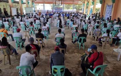 <p><strong>DISAFFILIATION</strong>. A total of 100 members of Anakpawis - Pamplona Municipal Chapter, 75 New People’s Army members from Sto Niño, Rizal and Piat in Cagayan, and 30 youths attend a disaffiliation ceremony at the Multi-Purpose Gymnasium of Barangay San Juan in Pamplona town, Cagayan on April 24, 2021. Claims of hardships and deception prompted them to sever ties with the communist groups. (<em>Contributed photo</em>)</p>