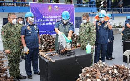 <p><strong>DESTROYED.</strong> PNP chief Gen. Debold Sinas (2nd from right) and other police officials lead the destruction of 7,371 beyond economical repair (BER) firearms in Camp Crame, Quezon City on Monday (April 26, 2021). Out of this number, 6,338 are beyond economical repair (BER) weapons that were confiscated or surrendered to the police force while the remaining 1,033 are BER weapons of the PNP. <em>(Photo courtesy of PNP Public Information Office)</em></p>