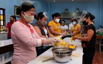 <p><strong>SKILLS TRAINING</strong>. More skills training are offered to displaced workers in Ilocos Norte. In this undated photo, some Ilocos Norte women learn how to process squash which is abundant in the province during summer. (<em>Photo courtesy of the Provincial Government of Ilocos Norte</em>) </p>