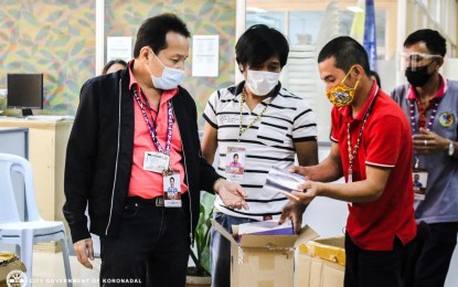 <p><strong>ANDROID TABLETS</strong>.  Koronadal City Mayor Eliordo Ogena (left), and city government personnel inspect the initial 1,600 Lenovo Tab M8 tablet computers it purchased for senior high school students (SHS) upon arrival at the city hall on Tuesday (April 27, 2021). The local government is planning to distribute a total of 4,750 tablets to SHS students in eight public schools before the opening of school year 2021-2022. (<em>Photo taken from the city government’s Facebook page</em>) </p>