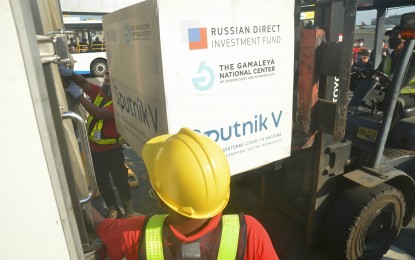 <p><strong>SPUTNIK V DELIVERED.</strong> The Philippines received 15,000 doses of Russian-made Sputnik V Covid-19 vaccines on Saturday (May 1, 2021). After the Qatar Airways flight landed at NAIA Terminal 3, the jabs were taken to the PharmaServ Express cold-chain storage facility in Marikina City. <em>(PNA photo by Robert Alfiler)</em></p>