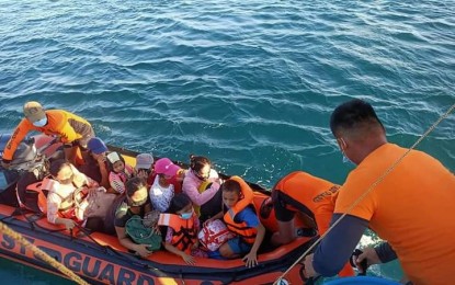 <p><strong>RESCUED.</strong> Personnel of Coast Guard Station Surigao del Norte (CGS-SDN) rescue 17 individuals and 19 crew members of FBCA NOBERT-2 that ran aground on May 1, 2021 in Barangay Cagutsan in Surigao City due to the strong sea current in the area. All the rescued individuals were in good physical and mental health condition when rescued.<em> (Photo courtesy of CGS-SDN)</em></p>