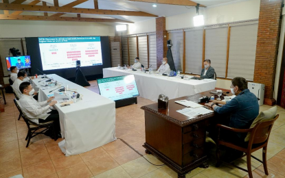 <p><strong>GOV’T ASSISTANCE</strong>. President Rodrigo Roa Duterte presides over a meeting with the Inter-Agency Task Force on the Management of Emerging Infectious Diseases (IATF-EID) core members prior to his talk to the people at the Malago Clubhouse in Malacañang Park, Manila on Monday night (May 3, 2021). Duterte said the government has been distributing aid to the low-income and poor families despite its limited resources. <em>(Presidential photo by King Rodriguez)</em></p>