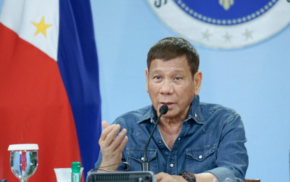 <p><strong>DOING GOOD</strong>. President Rodrigo Roa Duterte talks to the people after holding a meeting with the Inter-Agency Task Force on the Emerging Infectious Diseases (IATF-EID) core members at the Malago Clubhouse in Malacañang Park, Manila on Monday night (May 3, 2021). Duterte said the country is doing good in fighting the Covid-19 pandemic.<em> (Presidential photo by King Rodriguez)</em></p>