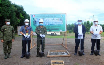 <p><strong>CONSTRUCTION STARTS. </strong>Officials led by BARMM Deputy Executive Secretary Abdullah Cusain (2nd from left), and Army’s 6ID commander Maj. Gen. Juvymax Uy (3rd from left) pose before the camera during the groundbreaking rites for the construction of the PHP11.24-million Covid-19 isolation facility at Camp Siongco in Barangay Awang, Datu Odin Sinsuat, Maguindanao on Monday (May 3, 2021). The facility is scheduled for completion within the next 45 days.<em> (Photo courtesy of BIO-BARMM)</em></p>