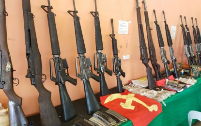 <p><strong>SURRENDER.</strong> The firearms and other war materiel from the 17 communist rebels who surrendered on May 3, 2021 in Manolo Fortich, Bukidnon, are displayed by the Army's 1st Special Forces Battalion under 403rd Brigade (403rd Bde) on Monday. The Army unit attributed the surrender to persistent negotiations with the rebels.<em> (Photo courtesy of 4ID)</em></p>
