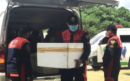 <p><strong>MORE VACCINES</strong>. Bureau of Fire Protection personnel in General Santos City unloads the cooler boxes containing vials of Sinovac’s CoronaVac doses upon arrival before noon Monday (May 3, 2021) at the cold chain facility in the city gymnasium. The city received some 3,733 doses intended for the first dose of the second batch of senior citizens, the second dose of the first batch, remaining frontline health care workers and Hajj pilgrims from the area. <em>(PNA GenSan photo by Richelyn Gubalani)</em></p>