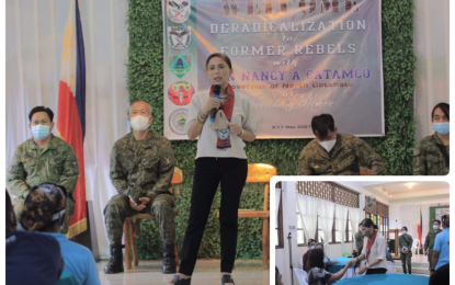 <p><strong>FULL SUPPORT.</strong> North Cotabato Governor Nancy Catamco gives her all-out support to the Army’s program for former rebels dubbed as “Deradicalization to former rebels” in North Cotabato during a welcome ceremony held Monday (May 3, 2021) in Kidapawan City. She fist-bumped with one (inset) of the 50 former members of the communist New People’s Army who had joined the program. <em>(Photo courtesy of NoCot PIO)</em></p>
