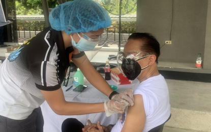 <p><strong>COVID-19 JAB</strong>. A photo from Chief Presidential Legal Counsel Salvador Panelo shows him getting inoculated with Sinopharm vaccine on Tuesday (May 4, 2021). It was the same brand administered by Health Secretary Francisco Duque III to President Rodrigo Duterte on Monday.<em> (Photo from Secretary Salvador Panelo)</em></p>