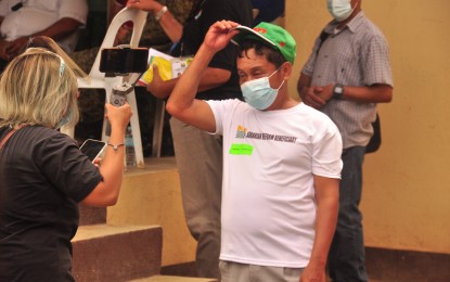 <p><strong>AGITATION STRATEGY</strong>. Virgilio Quisto, a former rebel, takes off his hat for a photo after testifying about the agitation strategy of the CPP-NPA to feed the people's discontent and rise in arms against the government. Quisto, who is now working for peace in Bohol, is one of the beneficiaries of the government's Comprehensive Agrarian Reform Program, receiving a 2.14-hectare land<em>. (Photo courtesy of PIA-Bohol)</em></p>