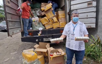 <p><br /><strong>FAKE GOODS</strong>. Bureau of Internal Revenue-Region 12 Director Antonio Jonathan Jaminola shows some of the fake cigarettes seized by his team along with fake tax stamps during a raid in a storage facility at Barangay Tangub, Bacolod City on Tuesday (May 4, 2021). They found an estimated PHP544 million worth of fake stamps and cigarettes, initial inventory showed. <em>(Photo by Erwin P. Nicavera)</em></p>