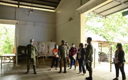 <p><strong>FOOD STORAGE</strong>. Officials from the Philippine Army and the Department of Social Welfare and Development (DSWD) check the warehouse inside the military camp in Catbalogan City, Samar that will be used as a storage facility for prepositioned food packs in this undated photo. The Army’s barracks at the 8th Infantry Division headquarters will serve as a strategic warehouse for the initial prepositioning of 3,000 food packs. <em>(Photo courtesy of DSWD)</em></p>