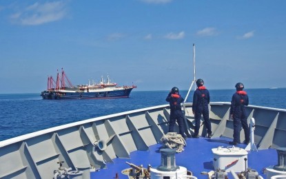 <p><strong>DRIVEN OUT. </strong>Joint teams of the Philippine Coast Guard and the Bureau of Fisheries and Aquatic Resources in Sabina Shoal drive away seven Chinese vessels on April 27, 2021. Sabina Shoal is located some 73 miles away from Mapankal Point in Rizal, Palawan and is part of the country’s Exclusive Economic Zone. <em>(Photo courtesy of PCG)</em></p>