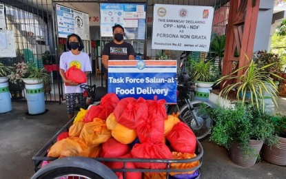 <p><strong>FOOD AID. </strong>A <em>kurong-kurong</em> tricycle is loaded with food packs to be distributed to pandemic-hit residents in Laoag City on Friday (May 7, 2021). These came from public and private donors. (<em>Photo courtesy of the Provincial Government of Ilocos Norte</em>) </p>
