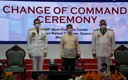 <p><strong>CHANGE OF COMMAND.</strong> DILG Secretary Eduardo Año (center) leads the change of command ceremony at the PNP headquarters in Camp Crame, Quezon City on Friday (May 7, 2021). In his message, Año reminded newly-appointed PNP chief, Gen. Guillermo Eleazar (left) to protect the sanctity of the Constitution while battling various threats like illegal drugs and terrorism.<em> (Photo courtesy of PNP-PIO)</em></p>