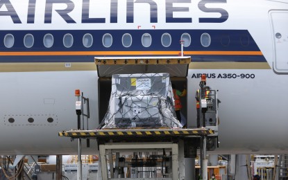 <p><strong>IMPORTANT DELIVERY.</strong> Singapore Airlines Flight SQ913 arrives with two million doses of AstraZeneca vaccines at the Ninoy Aquino International Airport Terminal 3 on Saturday (May 8, 2021). Health Secretary Francisco Duque III said more jabs are expected in the coming days.<em> (PNA photo by Joey Razon)</em></p>
