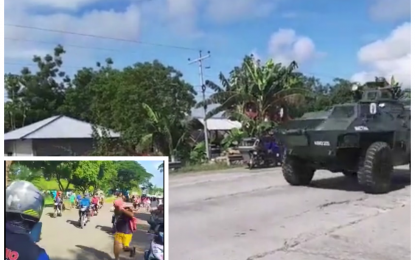 <p><strong>PROTECTING CIVILIANS</strong>. A military amphibious tank stands guard at the national highway in Datu Paglas, Maguindanao after some 200 armed members of the Bangsamoro Islamic Freedom Fighters (BIFF) seized the town’s public market early Saturday (May 8, 2021). Motorists (inset) were seen fleeing as the Army and the BIFF traded shots at the town center. <em>(Photos courtesy of DXMS Radio Cotabato)</em></p>