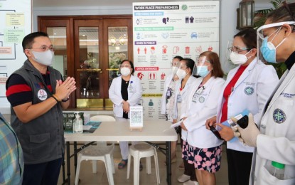 <p><strong>HEROES.</strong> Senator Bong Go talks to medical workers in this undated photo. As the country celebrated Health Workers’ Day on Friday (May 7, 2021), Go said continuous vaccine supplies will ensure more Filipinos will be inoculated, especially front-liners. <em>(Contributed photo)</em></p>
