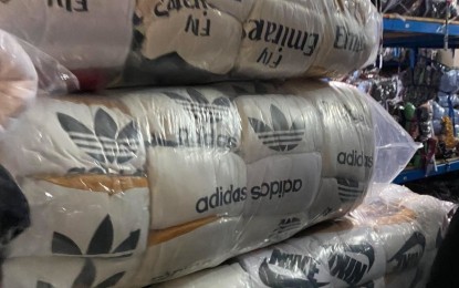 <p><strong>FAKE.</strong> Some of the counterfeit clothing items seized by Bureau of Customs officials in Pasay City on Friday (May 7, 2021). The seized goods have an estimated value of PHP300 million. <em>(Photo courtesy of BOC)</em></p>