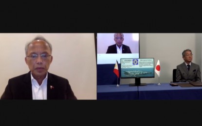 <p><strong>SECURING FUEL SUPPLY.</strong> Department of Energy Secretary Alfonso Cusi (left) and Japan Oil, Gas and Metals National Corporation chairman and chief executive officer Tetsuhiro Hosono during the virtual signing Wednesday (May 12, 2021) of the memorandum of agreement to start the study on fuel security in the country. Their partnership will also study the international strategic petroleum reserve program situation in the past five years to address supply disruptions.<em> (Screenshot from DOE Facebook livestream)</em></p>