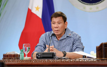 <p><strong>STRICTER GCQ.</strong> President Rodrigo Roa Duterte talks to the people after holding a meeting with the Inter-Agency Task Force on the Emerging Infectious Diseases (IATF-EID) core members at the Malago Clubhouse in Malacañang Park, Manila on Thursday night (May 13, 2021). Duterte downgraded the quarantine classification in the National Capital Region Plus (NCR Plus) and other areas to a more relaxed general community quarantine (GCQ) with “heightened restrictions.” <em>(Presidential photo by Richard Madelo)</em></p>