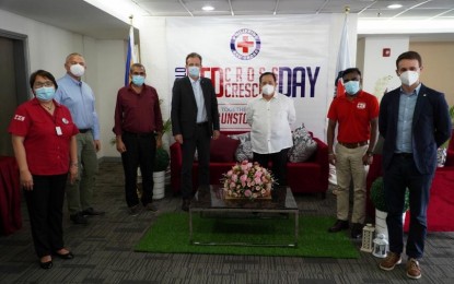 <p><strong>KEY PLAYERS.</strong> (From left) Philippine Red Cross (PRC) secretary general Elizabeth Zavalla, Canadian Red Cross’ Mladen Milicevic, American Red Cross’ Shir Shah Ayobi, International Committee of the Red Cross (IFRC) head of Philippine delegation Boris Michel, PRC chairman Senator Richard Gordon, IFRC support services coordinator Anath Pillay, and Spanish Red Cross’ Luis Carrasco gather during the World Red Cross and Red Crescent Day on May 8, 2021 in Mandaluyong City. The event celebrated the birth anniversary of Red Cross founder Henry Dunant. <em>(Photo courtesy of PRC)</em></p>