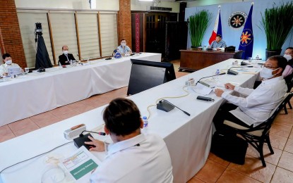 <p><strong>JABS REPORT.</strong> Vaccine czar Sec. Carlito Galvez Jr. (2nd from left) and other officials report to President Rodrigo Duterte during the Cabinet meeting on Thursday (May 13, 2021) in Malacañang. Galvez said the country has so far secured 202 million doses of Covid-19 vaccines. <em>(PCOO photo)</em></p>