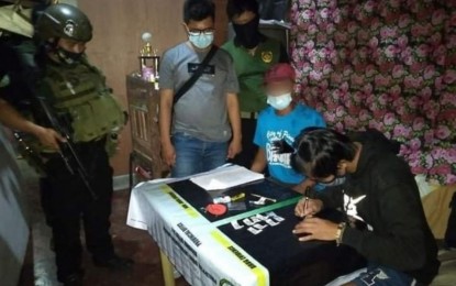 <p><strong>SEIZED.</strong> Anti-narcotics agents account for the firearm and shabu found in the possession of slain drug suspect Jay-Ar Lovino in Kabacan, North Cotabato on Thursday (May 13, 2021). A shootout ensued between the PDEA team and the suspect who drew out a .45 caliber pistol when surrounded by the arresting team.<em> (Photo courtesy of PDEA-12)</em></p>