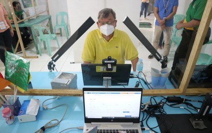 <p><strong>STEP 2.</strong> A Philippine Identification card applicant in Mabini, Pangasinan has his photographs taken in this March 2021 photo. After the Step 1 demographic registration, now being done online, the applicant will pick a schedule and accredited center for Step 2 biometrics capture (photos, iris can and fingerprint scan). <em>(Photo courtesy of Mabini LGU Facebook)</em></p>