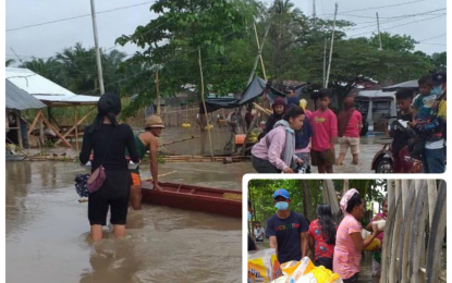 <p><strong>CALAMITY ASSISTANCE.</strong> Social workers onboard bancas distribute food packs (inset) to flood-affected villagers of Sultan sa Barongis town in Maguindanao on Tuesday (May 18, 2021). Scattered rains spawned by an intertropical convergence zone triggered the floods affecting at least six towns in the province. <em>(Photo courtesy of Barangay Barurao SSB)</em></p>