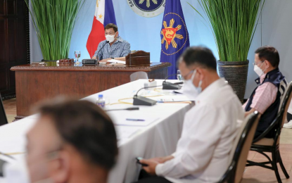 <p><strong>TALK TO THE PEOPLE</strong>. President Rodrigo Roa Duterte presides over a meeting with the Inter-Agency Task Force on the Emerging Infectious Diseases (IATF-EID) core members prior to his talk to the people at the Malago Clubhouse in Malacañang Park, Manila on May 13, 2021. Duterte meets with the ATF-EID twice a week to get updated on government’s Covid-19 response. <em>(Presidential photo by Richard Madelo)</em></p>