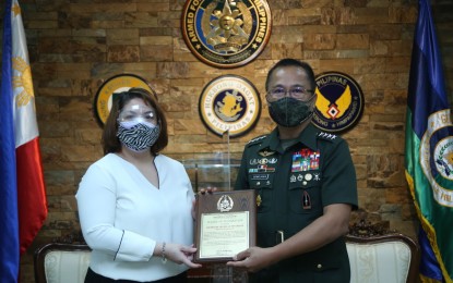 <p>Armed Forces of the Philippines chief Gen. Cirilito Sobejana and Ateneo School of Governance academic head Ma. Christina Alikpala<em> (AFP photo)</em></p>