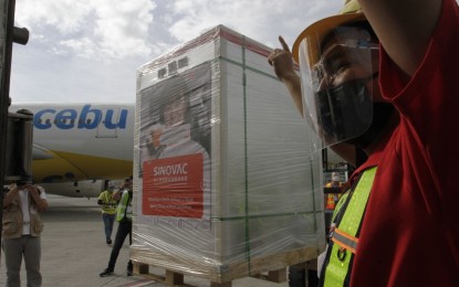 <p><strong>MORE VAX.</strong> The Philippines on Thursday (May 20, 2021) received 500,000 more doses of government-procured CoronaVac, bringing the country’s total stockpile of the vaccine so far to 5.5 million. The latest batch arrived at the Ninoy Aquino International Airport at 7:35 a.m. via a commercial Cebu Pacific flight. <em>(PNA photo by Avito C. Dalan)</em></p>