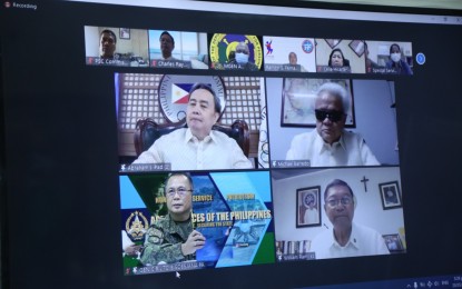 <p><strong>HONING WORLD-CLASS ATHLETES.</strong> AFP chief, Gen. Cirilito Sobejana (bottom left frame), and executives of major sports organizations sign a memorandum of agreement in a virtual ceremony in Camp Aguinaldo, Quezon City on Thursday (May 20, 2021). The agreement provides for the management, development, and training of identified and potential soldier-athletes who shall compete in international sports competitions. <em>(Photo courtesy of AFP Public Affairs Office)</em></p>