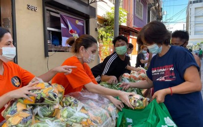 <p><strong>YOUTH SECTOR.</strong> The Sangguniang Kabataan of Barangay 634 in Manila’s Sixth District puts up a community pantry, comprised mostly of fresh produce, in this May 2021 photo. Pantries have sprouted nationwide to help the less privileged sectors cope with the economic effects of the Covid-19 pandemic.<em> (Photo courtesy of Manila-PIO)</em></p>