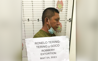 <p><strong>EXTORTION SUSPECT</strong>. PSSg. Ronelo G. Tering-Tering, assigned at the Highway Patrol Group Team in Agusan del Norte, is arrested in an entrapment operation conducted Monday morning (May 24, 2021) at the HPGT office in Cabadbaran City for alleged extortion. He allegedly demanded PHP20,000 for the release of an impounded mini-dump truck<em>. (Photo grabbed from ADNPPO Media Partners Group Chat)</em></p>