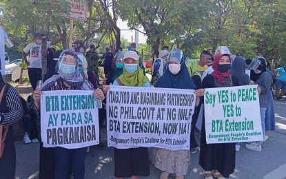 <p><strong>YES TO BTA EXTENSION.</strong> Members of the Bangsamoro People’s Coalition for the Bangsamoro Transition Authority (BTA) Extension hold a peaceful rally in front of the Senate building in Pasay City on Tuesday (May 25, 2021). The group said the BTA's extension until 2025 will help it complete transitional programs and projects for constituents that were hampered by the coronavirus pandemic.<em> (Photo courtesy of the Bangsamoro People’s Coalition for the BTA Extension)</em></p>