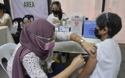 <p><strong>VAX PROGRAM.</strong> A nurse administers a Covid-19 vaccine on a person with comorbidity in Cebu City in this May 5 photo. DOH-7 chief pathologist Dr. Mary Jean Loreche on Thursday (May 27, 2021) urged the remaining medical front-liners master-listed under the A1 sector to immediately get the jabs to give way to other priority groups in the mass vaccination rollout. <em>(Photo courtesy of Cebu City Hall PIO)</em></p>