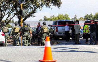 <p><strong>MASS SHOOTING.</strong> Police and investigators work at the scene of a mass shooting in San Jose, California, in the United States, on Wednesday (May 26, 2021. The Department of Foreign Affairs confirmed that one of the eight people who were killed in the shooting is of Filipino descent. <em>(Photo by Dong Xudong/Xinhua)</em></p>