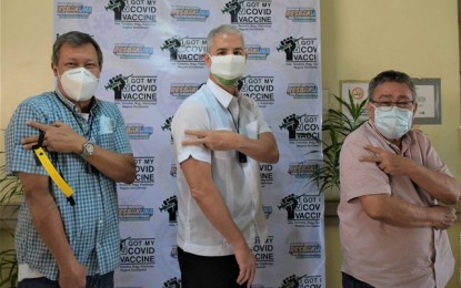 <p><strong>2ND DOSE DONE</strong>. Negros Occidental Governor Eugenio Jose Lacson (center) gets fully vaccinated against Covid-19 after receiving the second dose of Sinovac’s CoronaVac jab at the Teresita L. Jalandoni Provincial Hospital in Silay City on Friday (May 28, 2021). Mayors Manuel Escalante III of Manapla (left) and Pedro Zayco of Kabankalan City also availed of their second doses together with Lacson. <em>(Photo courtesy of PIO Negros Occidental)</em></p>