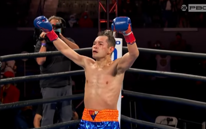 <p><strong>CHAMP AGAIN</strong>. Nonito Donaire celebrates after knocking out erstwhile unbeaten Nordine Oubaali of France in the fourth round to regain the WBC bantamweight title at the Dignity Health Sports Park in Carson, California on Sunday (Manila Time). The 38-year-old Donaire became the oldest bantamweight champion of all time. <em>(Screenshot/PBC)</em></p>